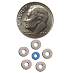Dime and six small orthodontic brackets displayed for size comparison on white background.